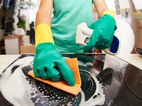 Local Hackney cleaner working in a bright residential space